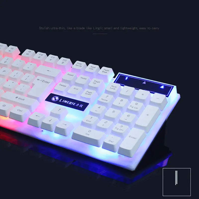 GTX300 black and white wired gaming keyboard and mouse set with backlit keys on a desk