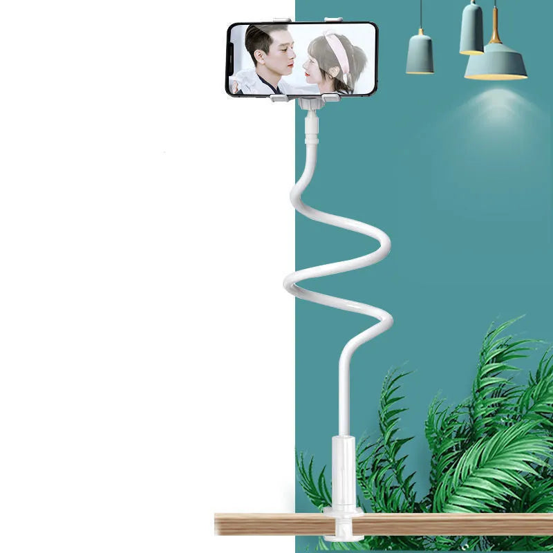 Blue mobile phone holder with flexible memory alloy hose positioned on a bedside table, holding a smartphone.