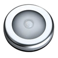 Silver circular motion sensor night light with 80mm diameter on table
