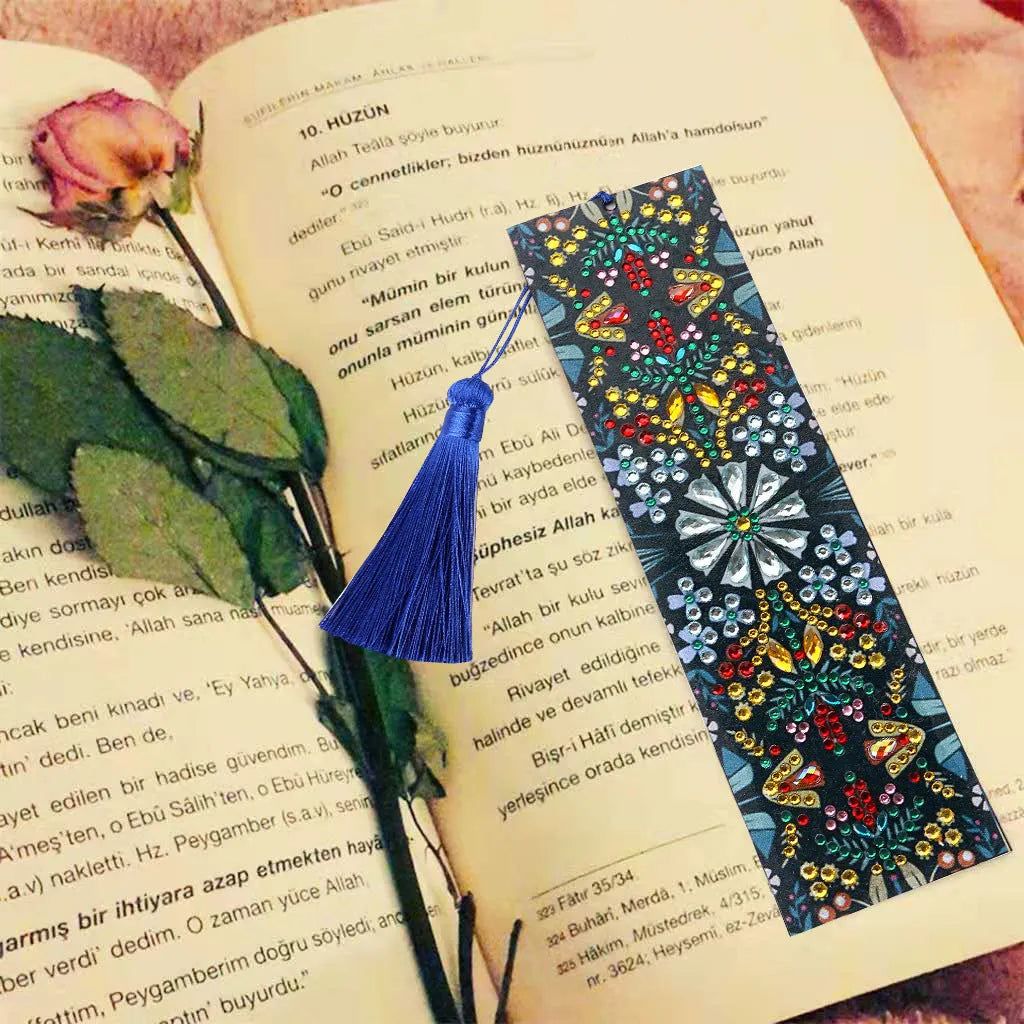 Diamond painting bookmark with leather backing showing intricate mandala flower patterns created with special-shaped diamond embroidery