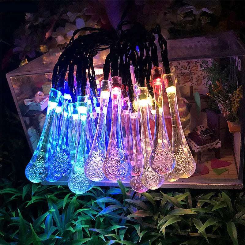 Solar LED outdoor string lights with water drop shaped pendants on a 6.5 metre cable for garden decoration