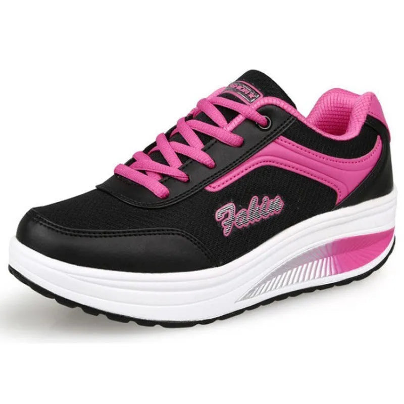 Women's heelless sports travel shoe in a mid-heel style, shown in a selection of available colours.