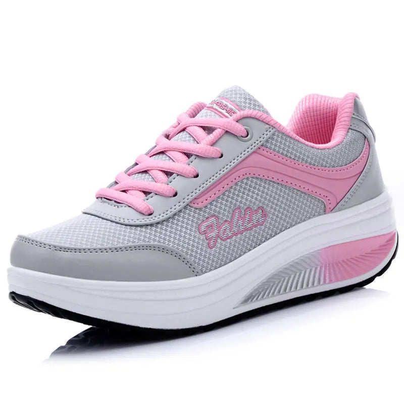 Women's heelless sports travel shoe in a mid-heel style, shown in a selection of available colours.
