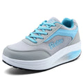 Women's heelless sports travel shoe in a mid-heel style, shown in a selection of available colours.