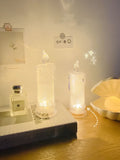 A white LED bedside lamp on a wooden table, shown next to a message board variant with an erasable pen.