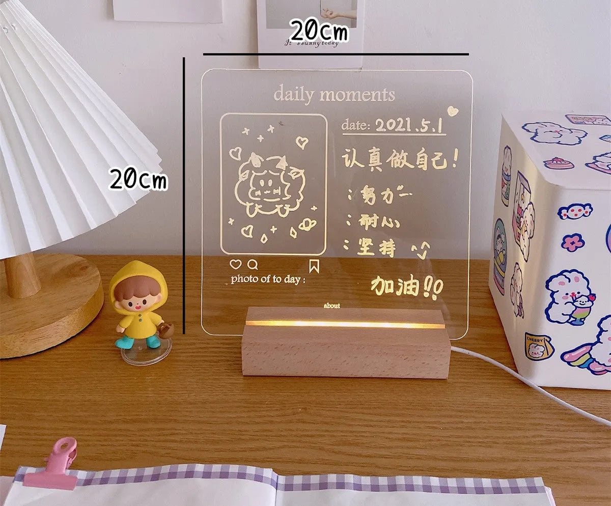 A white LED bedside lamp on a wooden table, shown next to a message board variant with an erasable pen.