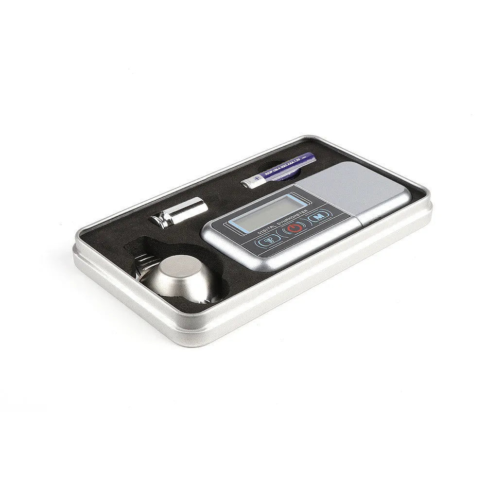 White electronic digital scale with 100g capacity and 0.005g accuracy for jewellery and turntable use.