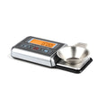 White electronic digital scale with 100g capacity and 0.005g accuracy for jewellery and turntable use.