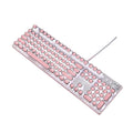 Wired silver mechanical keyboard with pink round keycaps and green switches next to matching mouse.