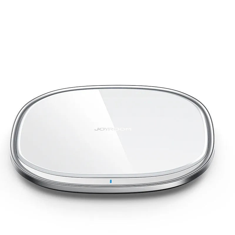 Black and white 15W wireless phone charger with zinc alloy and glass build on a desk.