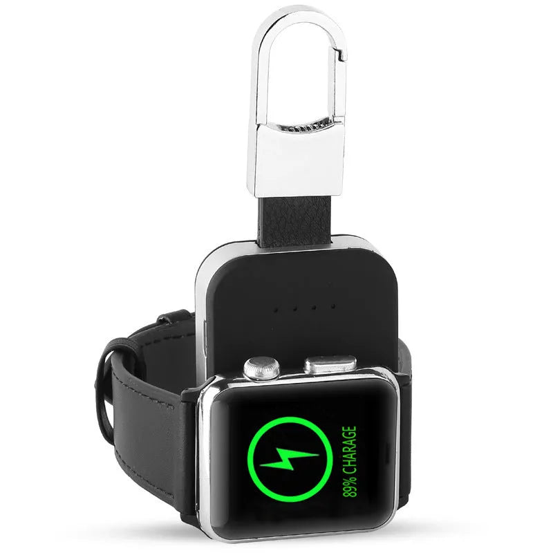 Black keychain-sized wireless power bank for Apple Watch showing front view and size relative to a keyring.