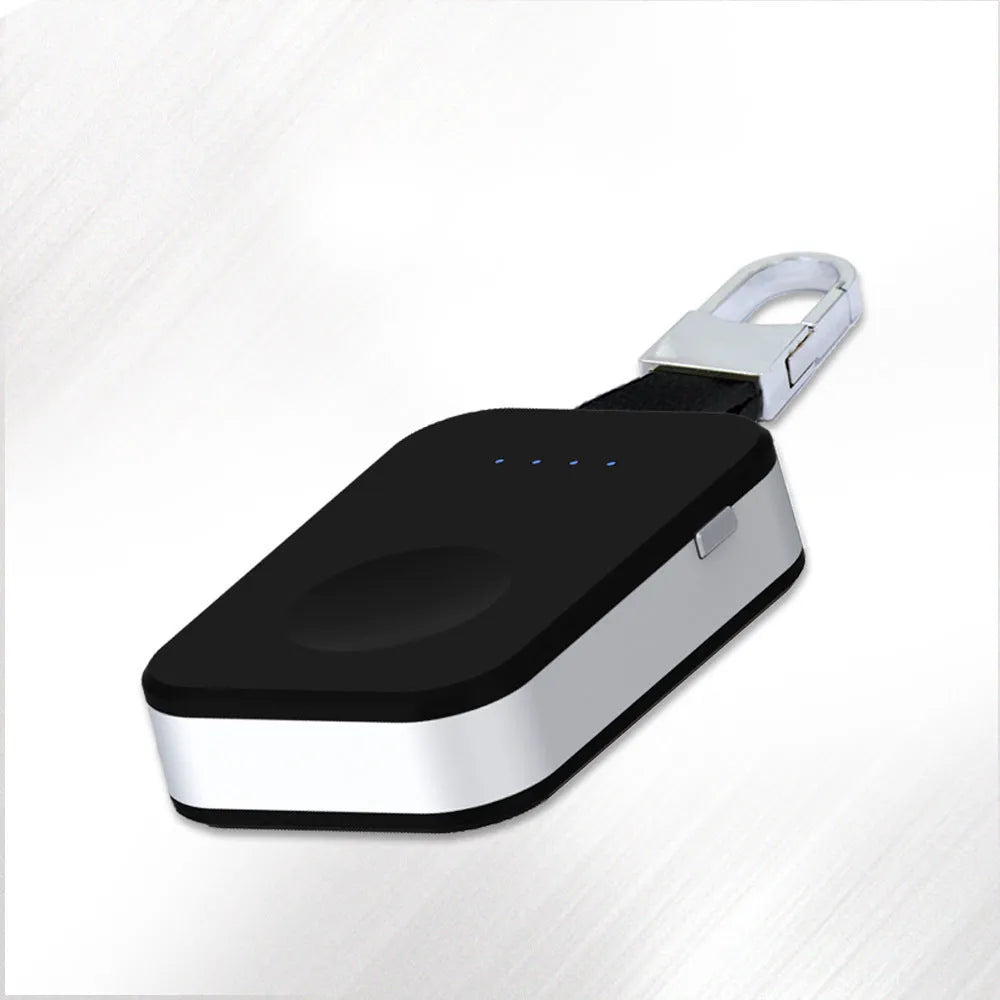 Black keychain-sized wireless power bank for Apple Watch showing front view and size relative to a keyring.