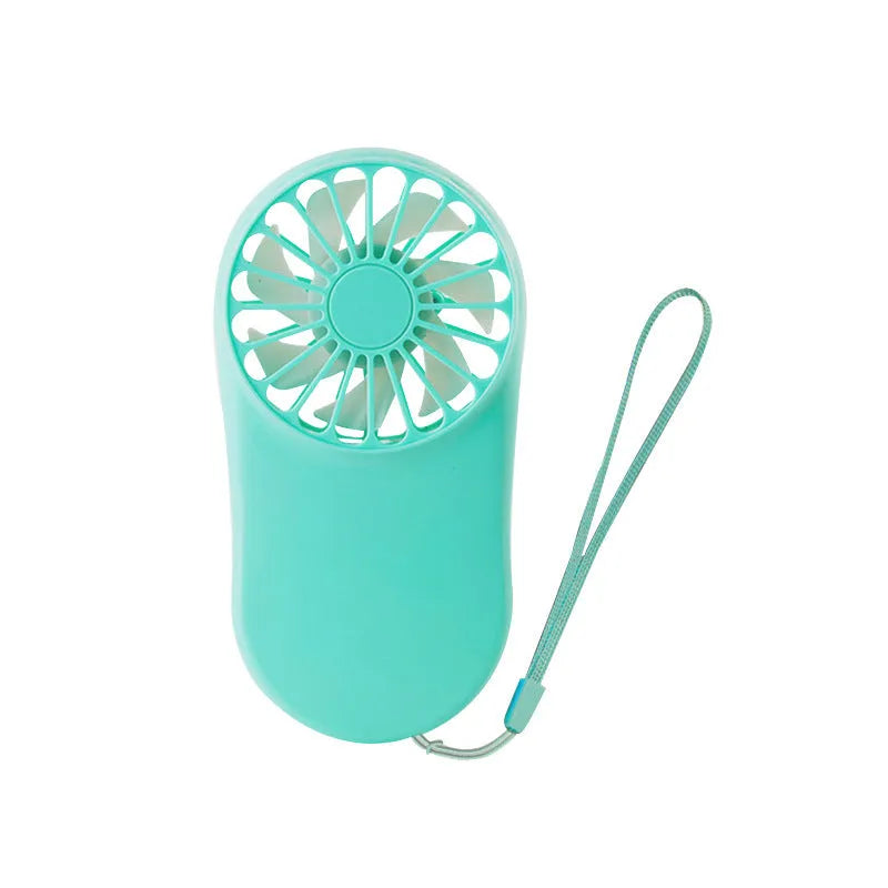 A person wearing a black hands-free neck fan with dual air vents, adjustable strap, and USB charging port.