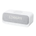 White Anker Soundcore Bluetooth speaker with wireless charging top and digital clock display