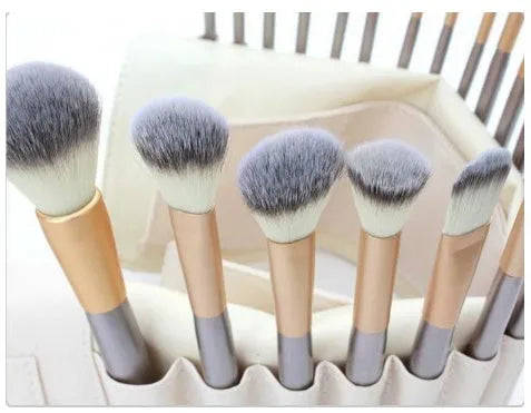 Persian make-up brush set with rice white brush heads and champagne coloured handles, shown in a set.