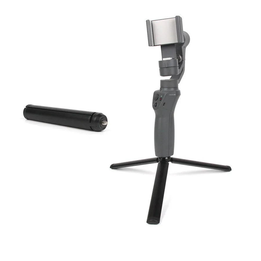 Black aluminium mobile phone tripod stabilizer with PTZ functionality on a table