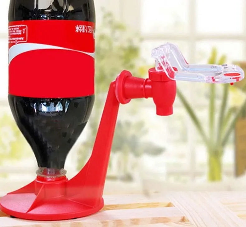 Red plastic Magic Tap soda bottle dispenser attached to a 2-litre bottle.