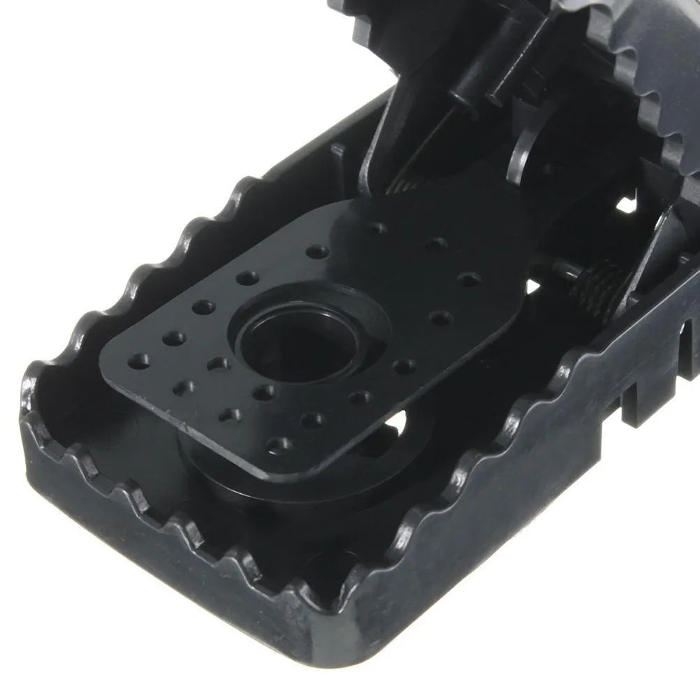 Six black snapping mousetraps showing PC+ABS alloy plastic construction and biting mechanism