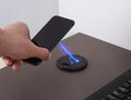 Black round 60mm wireless charging pad for embedded installation in desks and furniture.