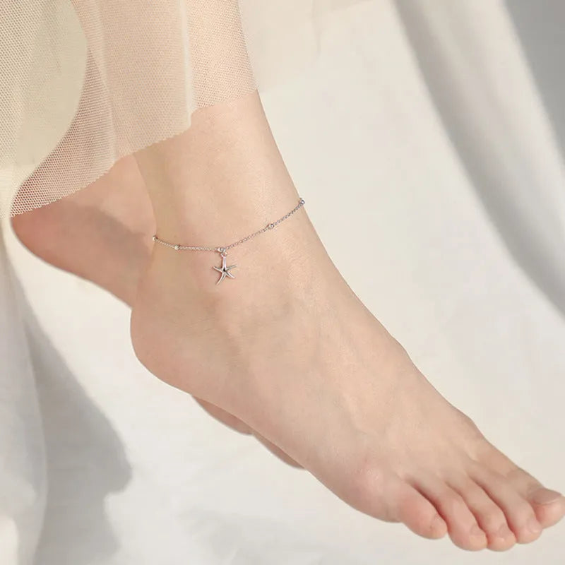 Women's sterling silver anklet with starfish charm and round beads on adjustable chain