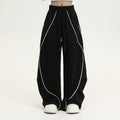 Black pleated wide-leg hip hop pants with striped pattern and mid-waist design made of polyester