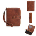 Women's black PU leather zip coin purse with integrated card slots lying open.