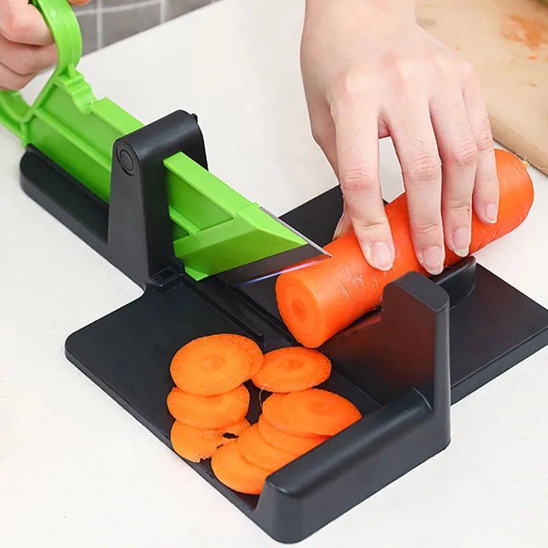Green and red plastic vegetable cutter with stainless steel blades for carrots and potatoes