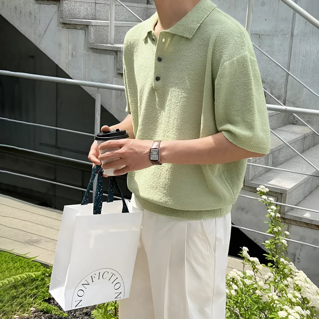 Men's caramel coloured retro asymmetric knitted polo shirt on a hanger, loose fit short sleeve.