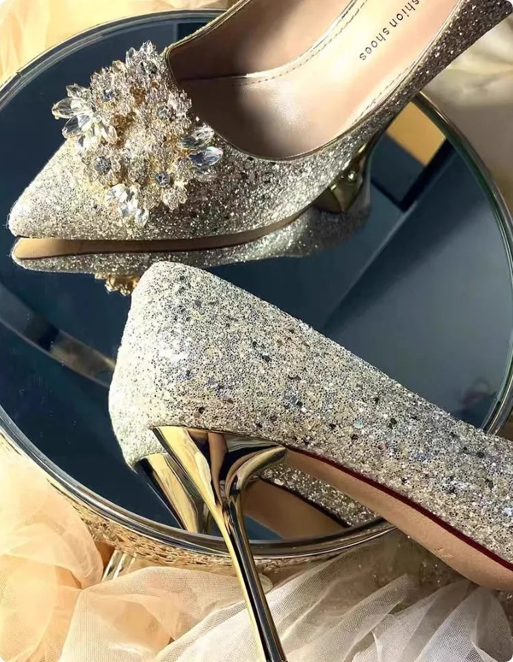 Champagne coloured women's wedding high heel shoes with crystal decoration and a pointed toe.