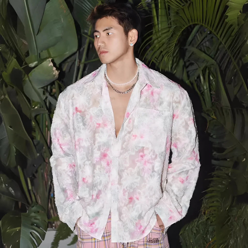 Man wearing a blue floral embossed long sleeve shirt with a loose fit
