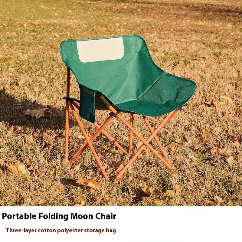 Beige folding chair with Oxford cloth seat and steel frame in outdoor setting