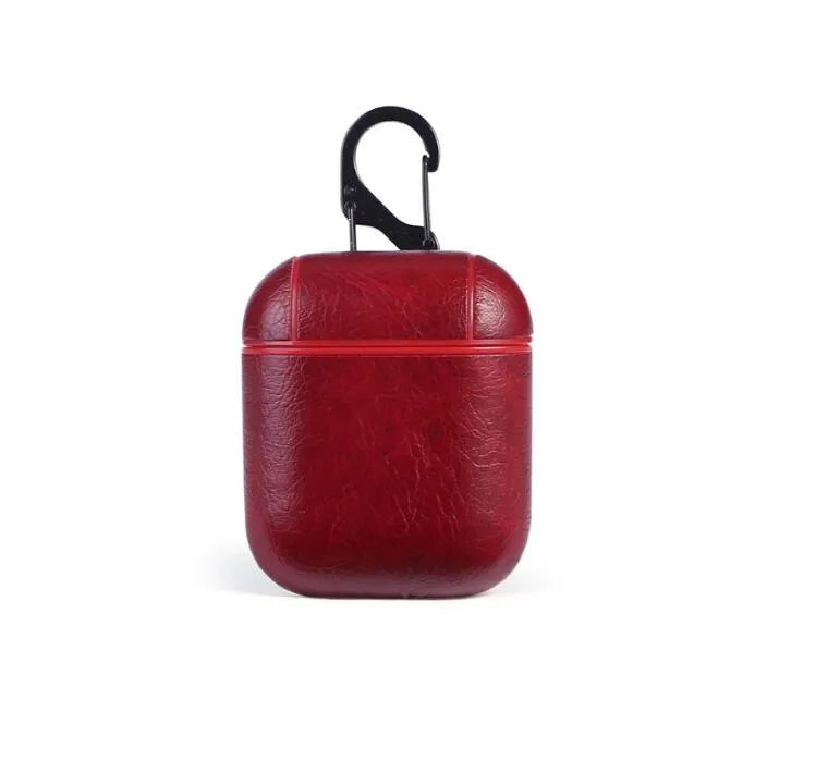Genuine leather protective case sleeve for Apple Airpods charging case in black, brown, light brown, and red.