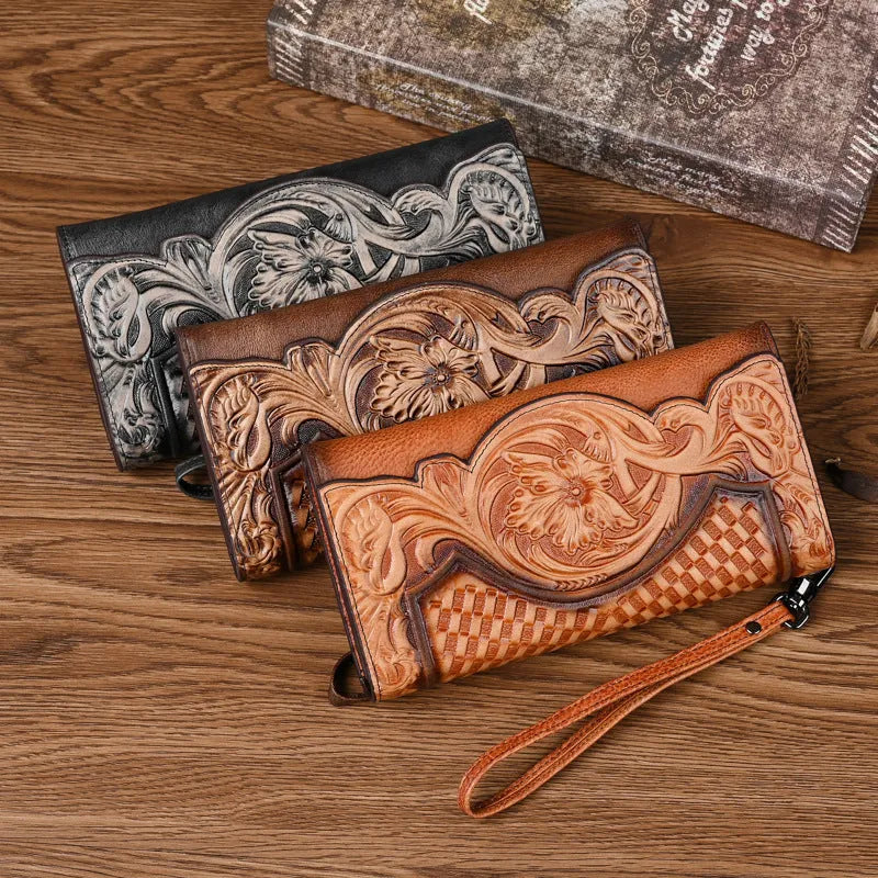 Women's brown embossed floral pattern tri-fold cowhide leather wallet showing interior compartments