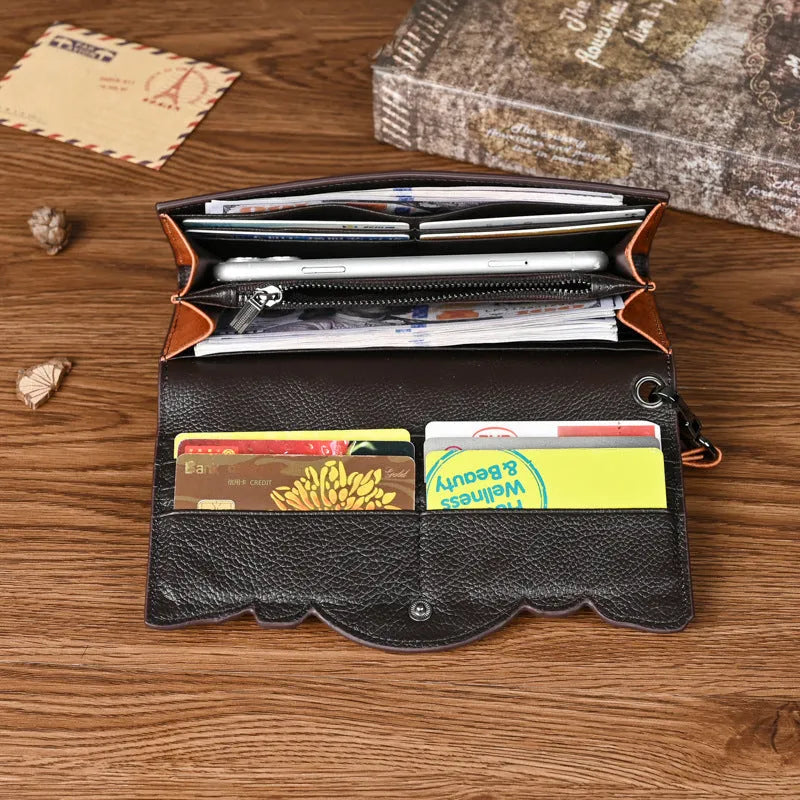 Women's brown embossed floral pattern tri-fold cowhide leather wallet showing interior compartments
