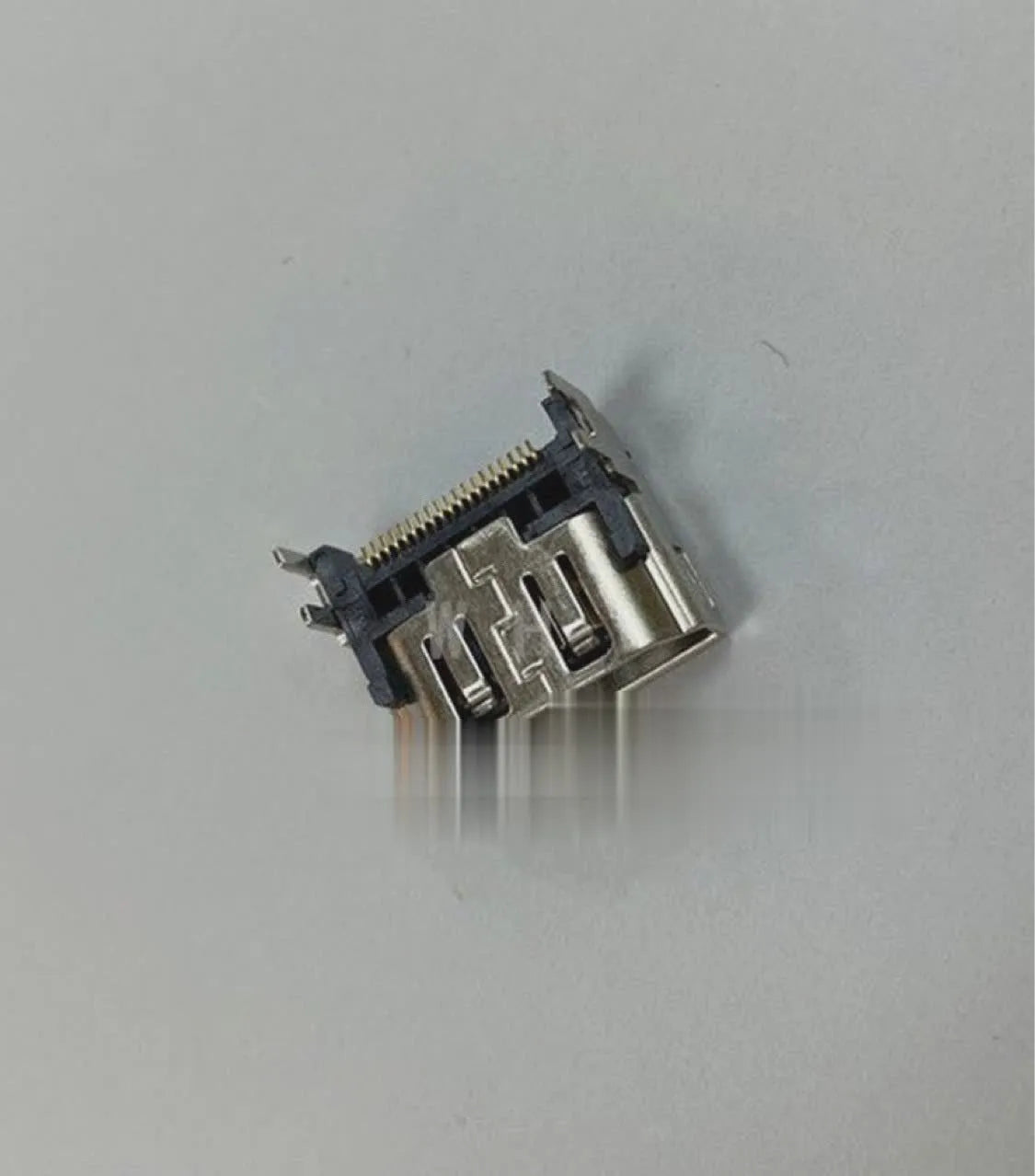 Silver metal HDMI interface socket for gaming console repair and port replacement