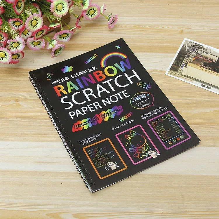 Children's large scratch art paper with scraper tool revealing colourful puzzle design