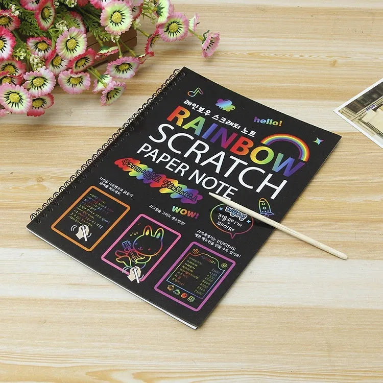 Children's large scratch art paper with scraper tool revealing colourful puzzle design