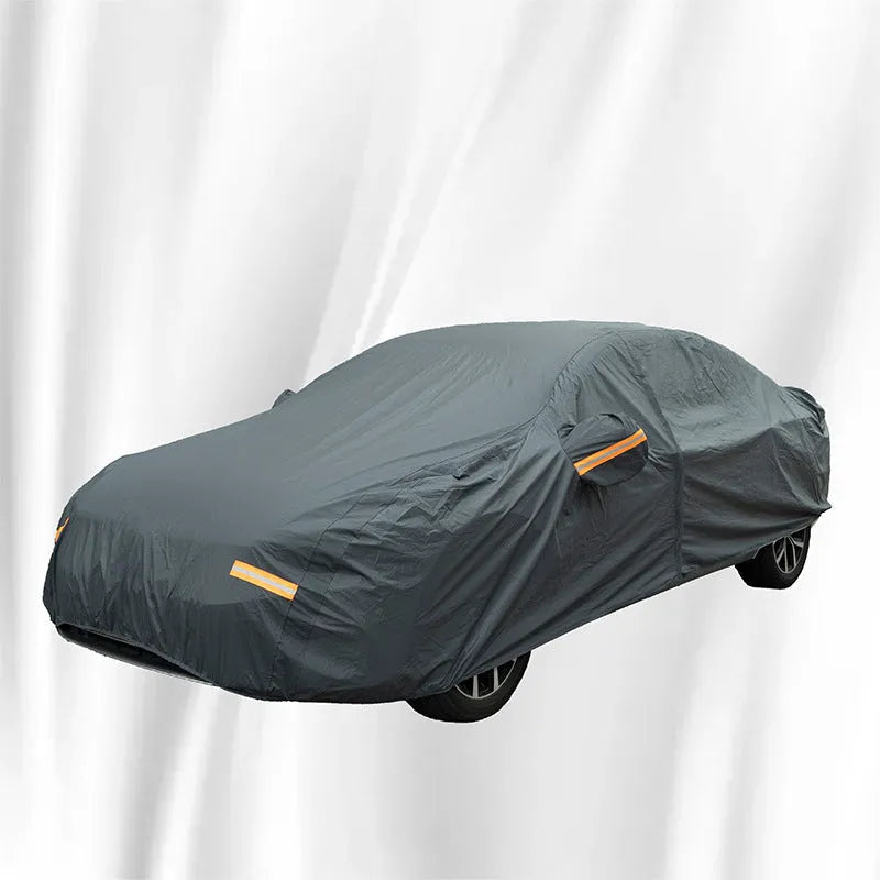 Grey thickened PVC car cover for Volkswagen vehicles, shown in a folded state.