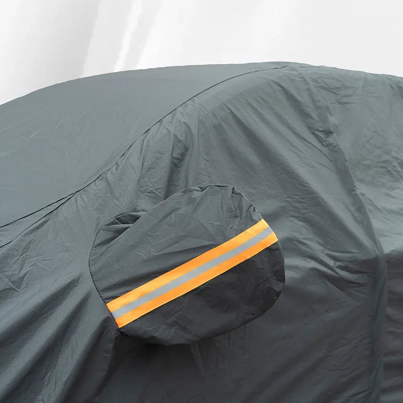 Grey thickened PVC car cover for Volkswagen vehicles, shown in a folded state.