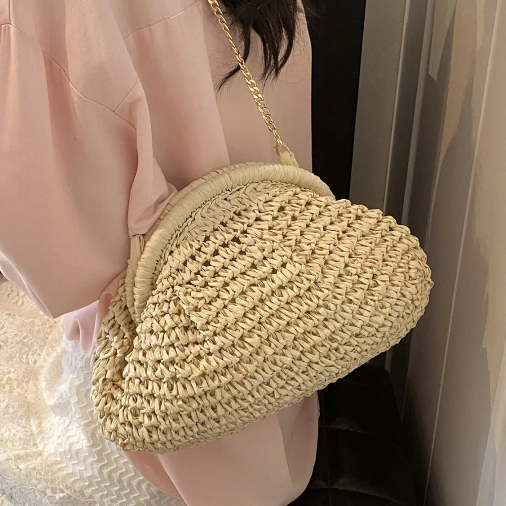 Women's woven paper straw beach bag with shoulder chain in khaki colour showing interior zip pocket