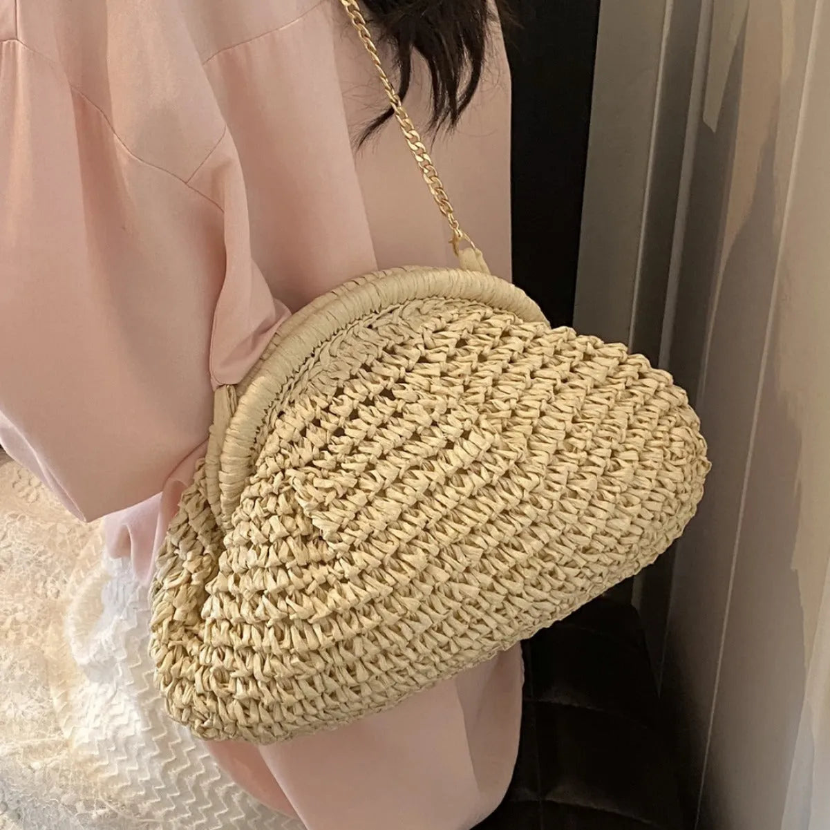 Women's woven paper straw beach bag with shoulder chain in khaki colour showing interior zip pocket