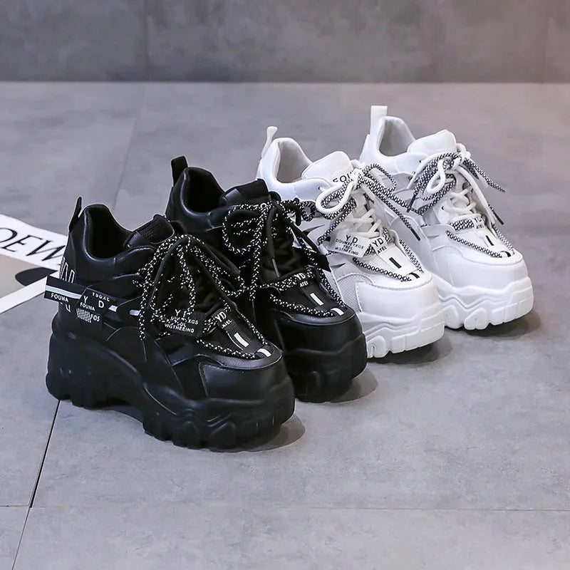 Women's white breathable mesh platform sports shoes with a cross strap and rubber sole.