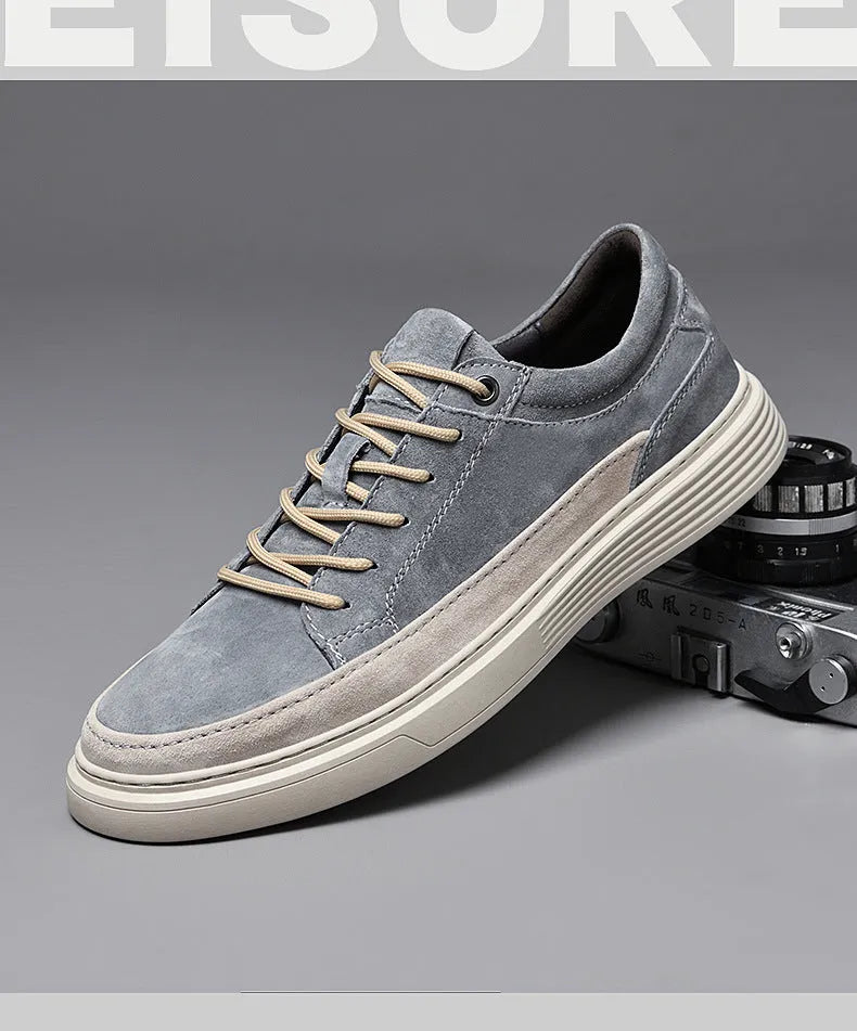 Men's grey casual leather skate shoes with round toe and lace-up front on a rubber sole.