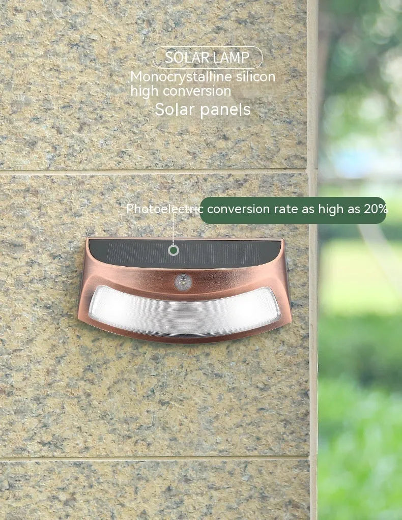 Solar outdoor wall lamp with smiling face design for garden courtyard lighting