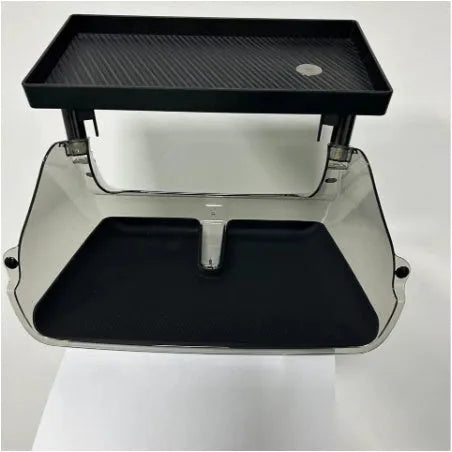 Black ABS plastic storage box installed under the touchscreen in a Tesla Model Y centre console.