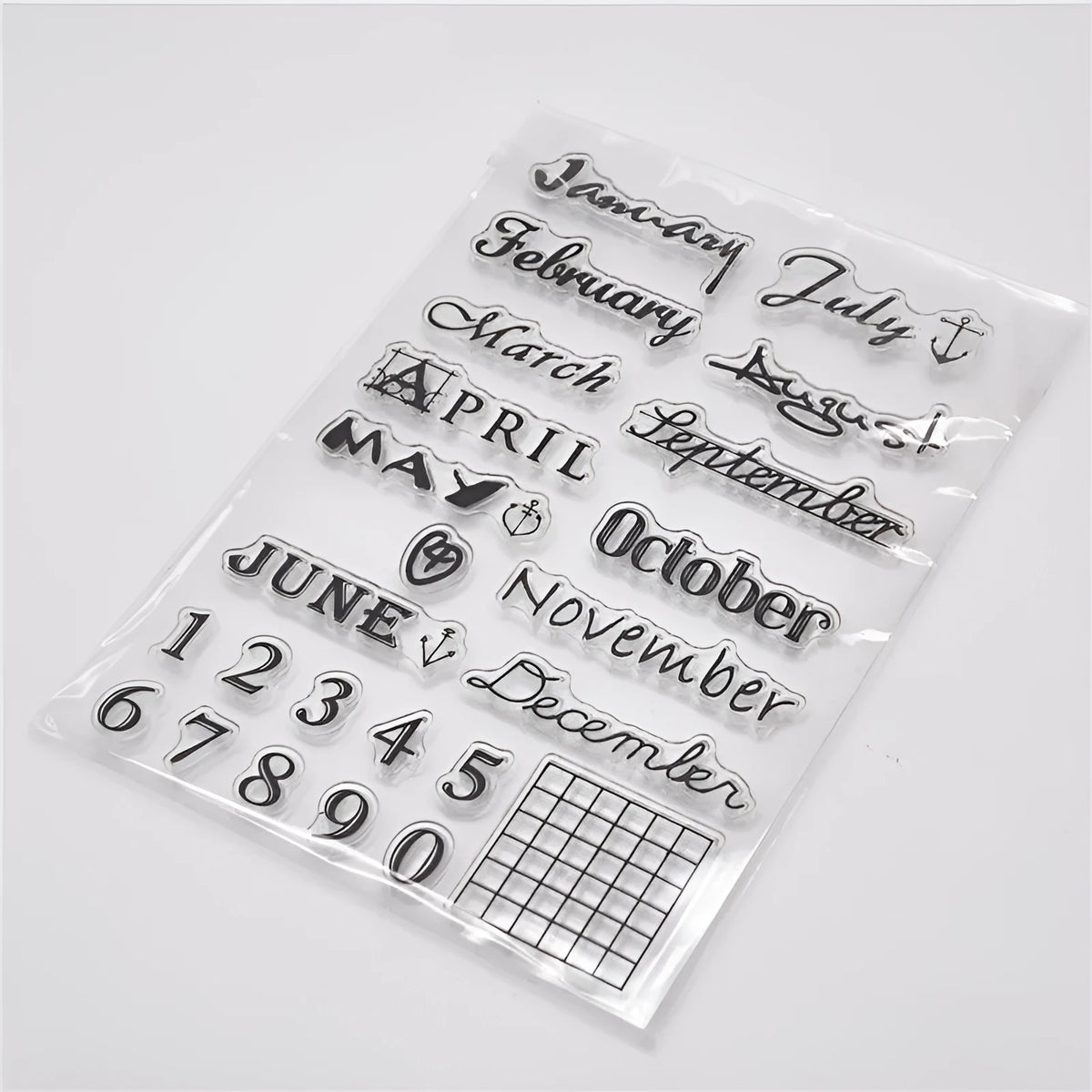 Close-up of a transparent silicone vintage calendar and digital table icon stamp on a white background.