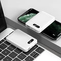 Black and white portable power bank with dual USB ports showing capacity options from 4000mAh to 10000mAh