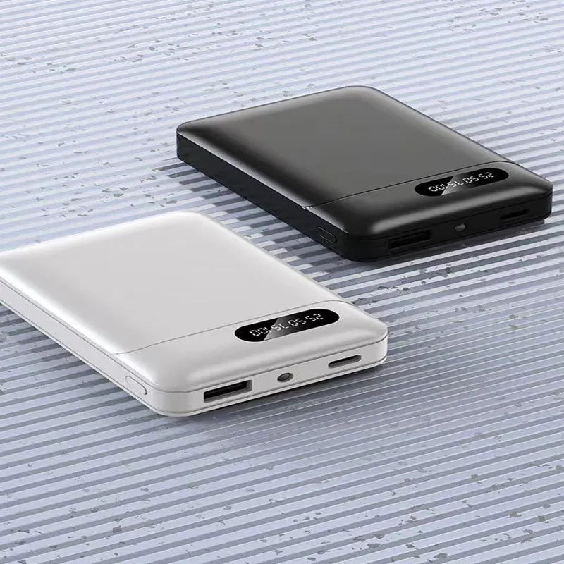 Black and white portable power bank with dual USB ports showing capacity options from 4000mAh to 10000mAh