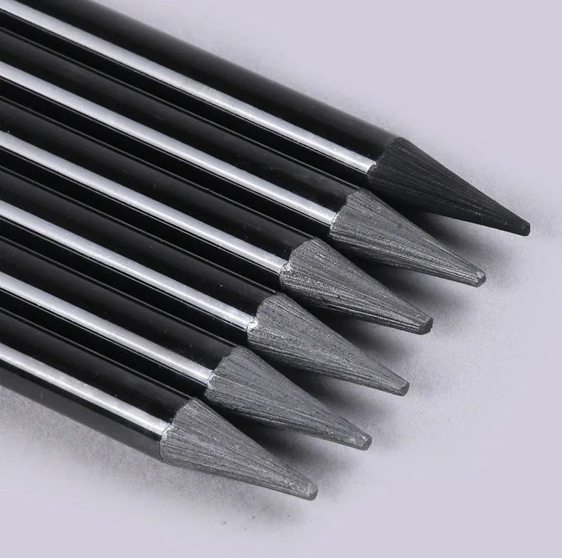 Carbonised pencil suit showing six graphite and three carbonised wooden pencils on suction card packaging