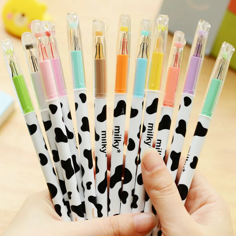 Box of twelve cow print patterned gel pens with 0.38mm fine tips in assorted colours.